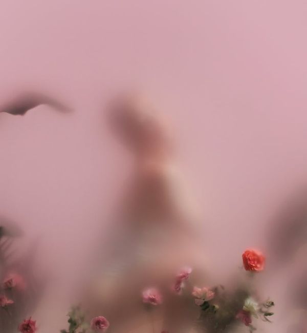 Silhouette of a person stretching against a serene background.